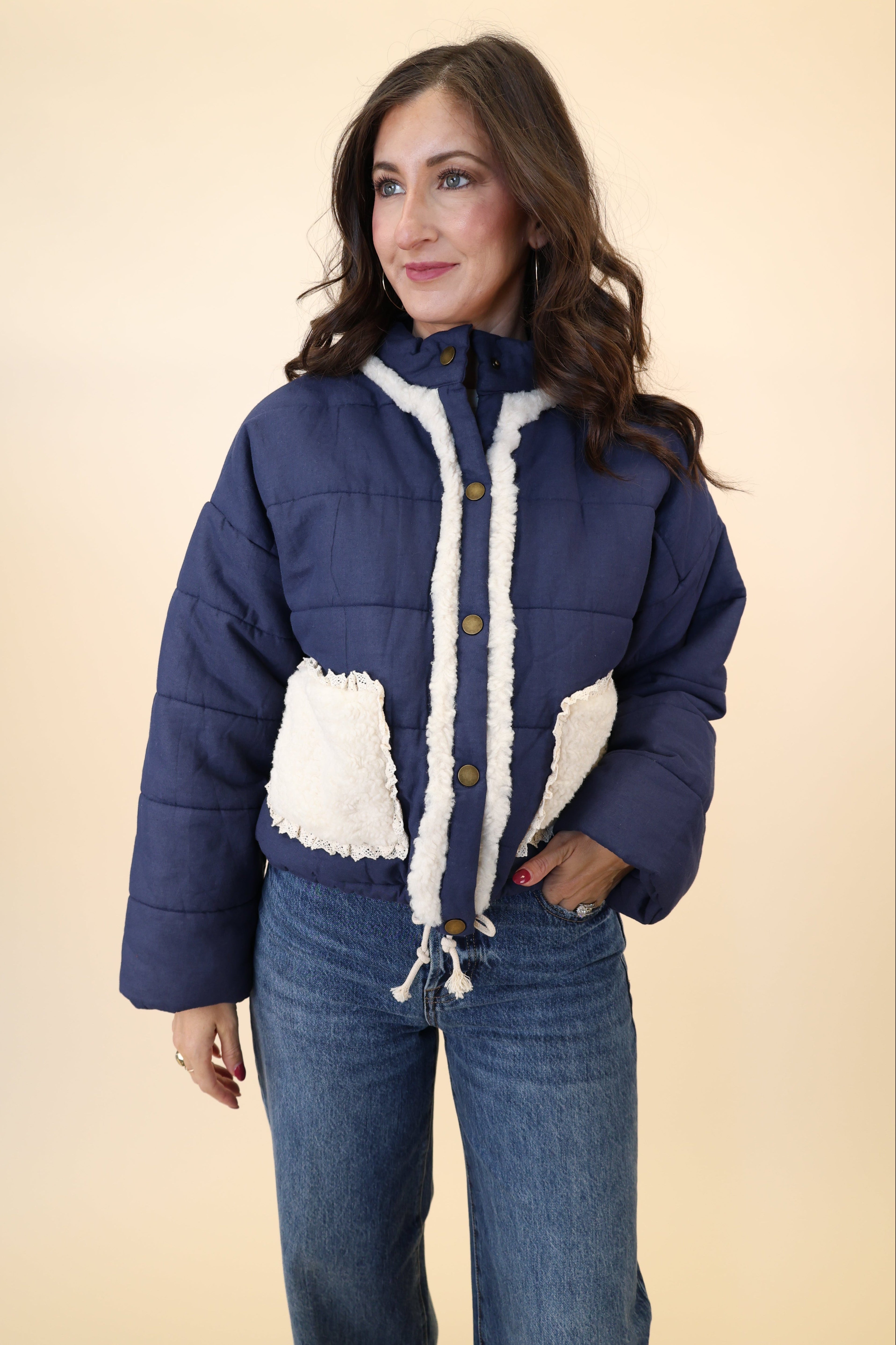 Miou Muse navy quilted jacket with white sherpa front pockets and adjustable drawstring hem