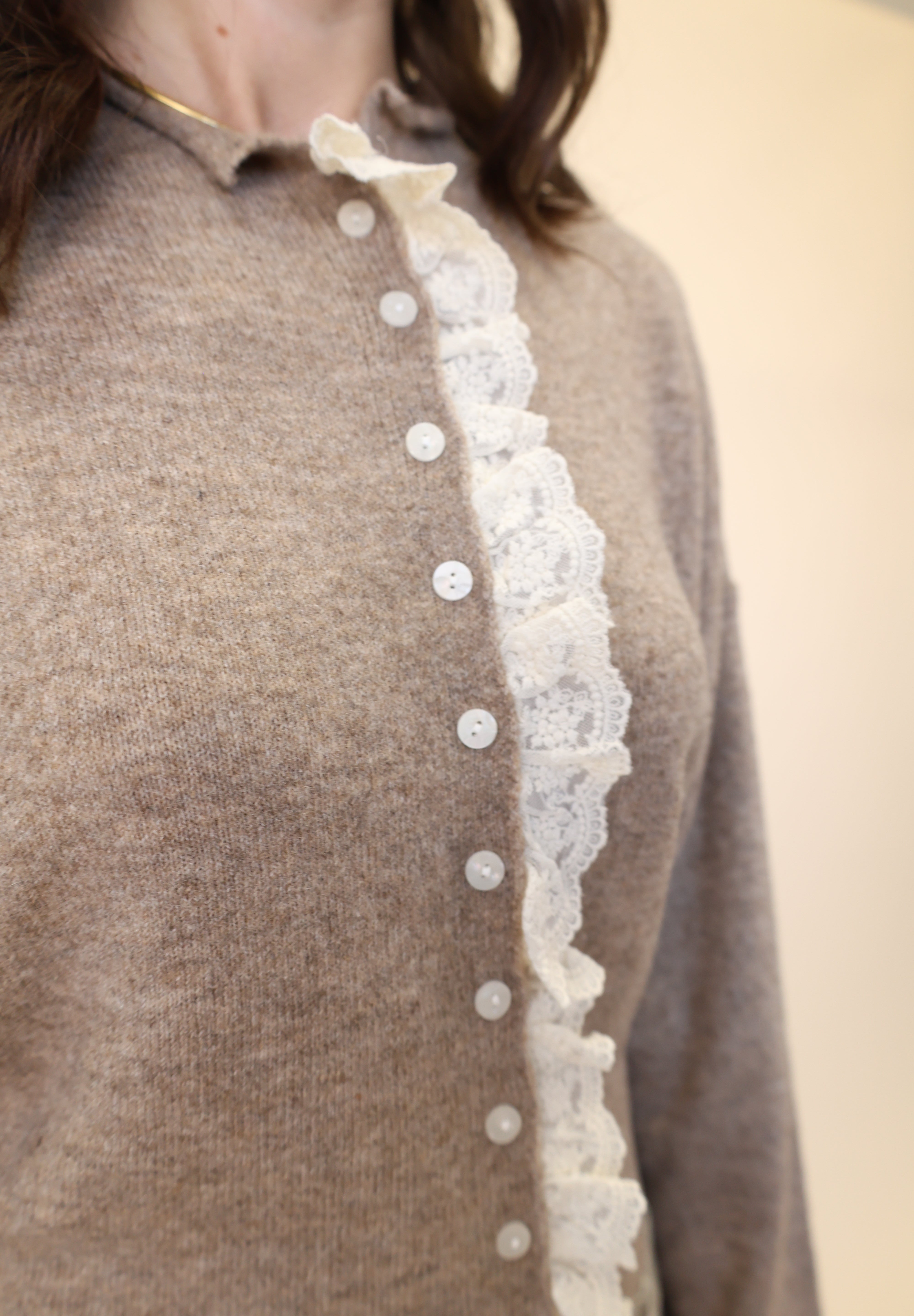 Beige button-down cardigan by Miou Muse featuring romantic white lace detailing