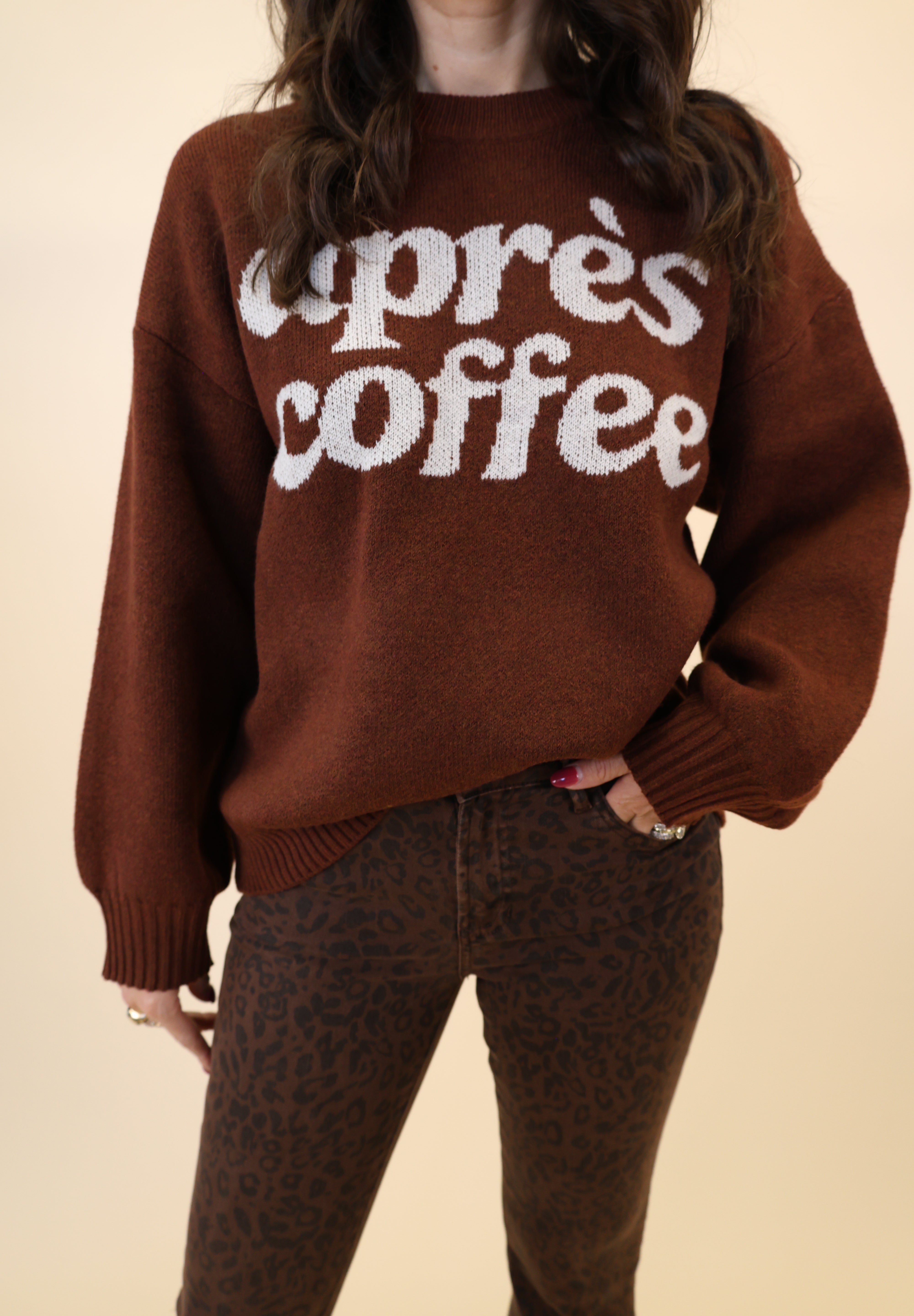 Cozy brown knit sweatshirt by Girl Dangerous featuring white “Après Coffee” graphic
