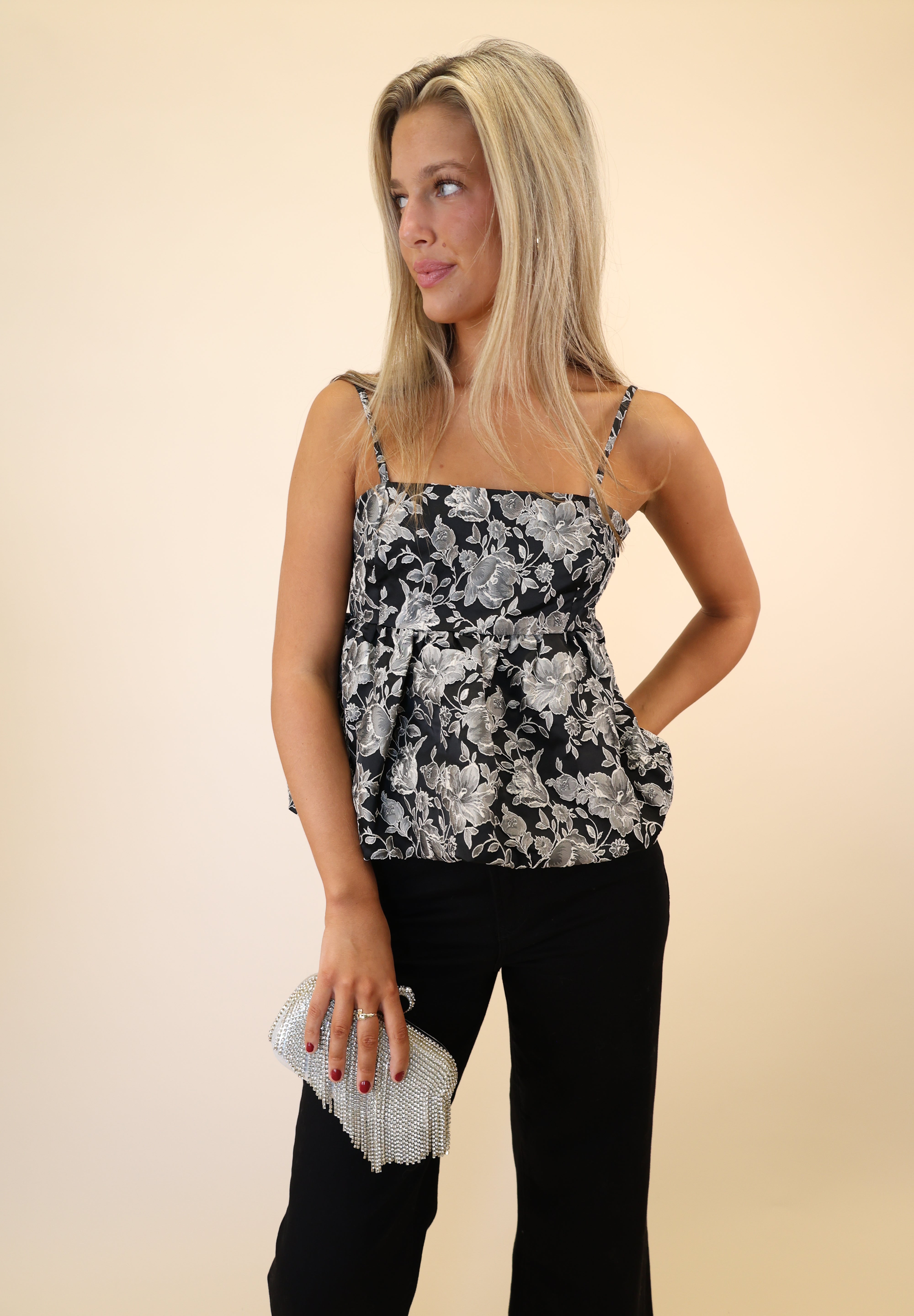 Black and white floral Bodi Top by Steve Madden showcasing a flattering square neckline and bubble-style hem.
