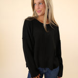 Dear John black Ayat Sweater with a classic crew neckline, ribbed sleeves, and a casual drop-shoulder fit.