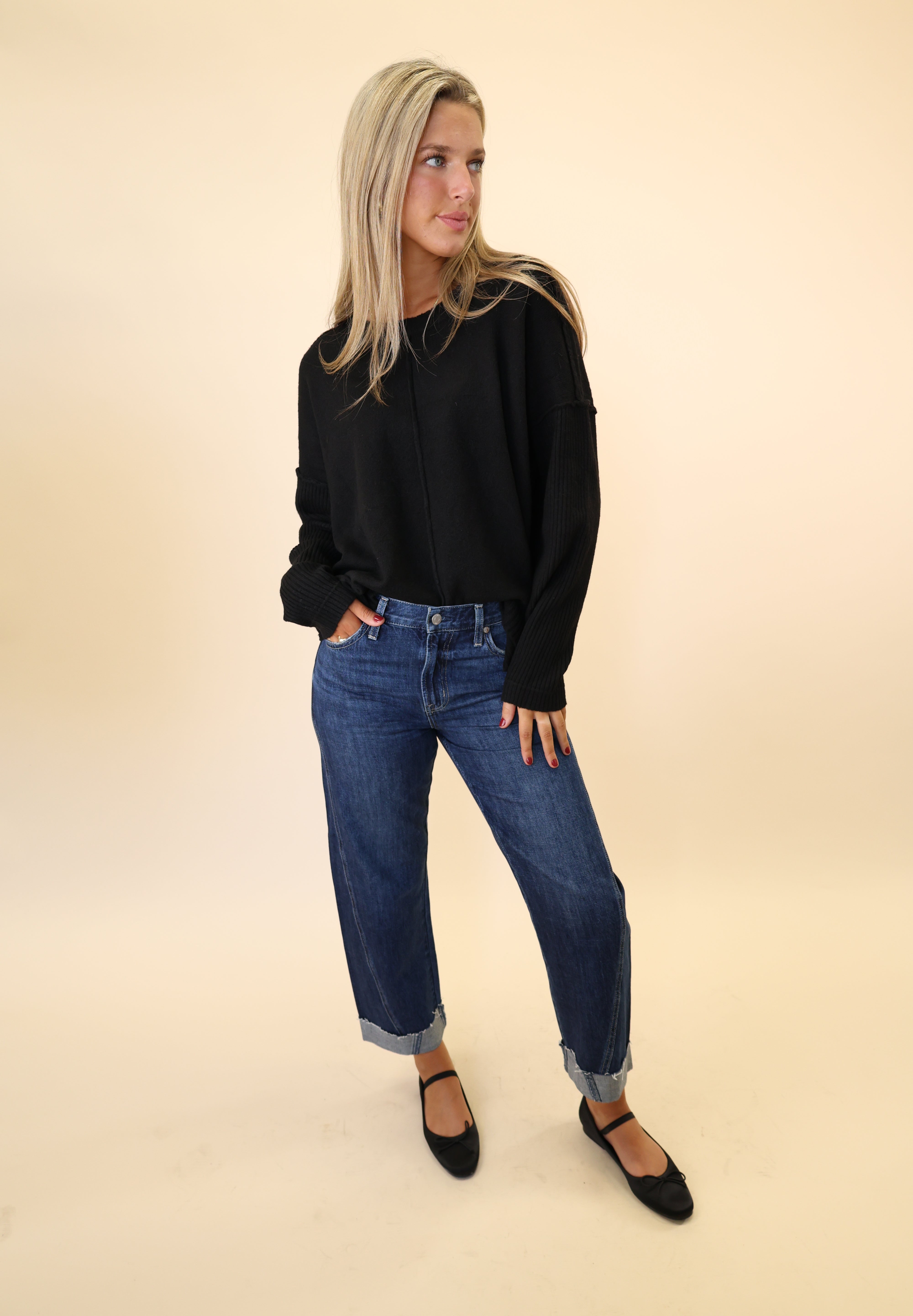 Soft black Dear John sweater featuring a crewneck design, drop shoulders, and ribbed texture on the sleeves.