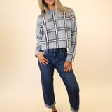 Fashionable grey plaid women’s sweater by DeLuc Jacob, mock neck, long sleeves.