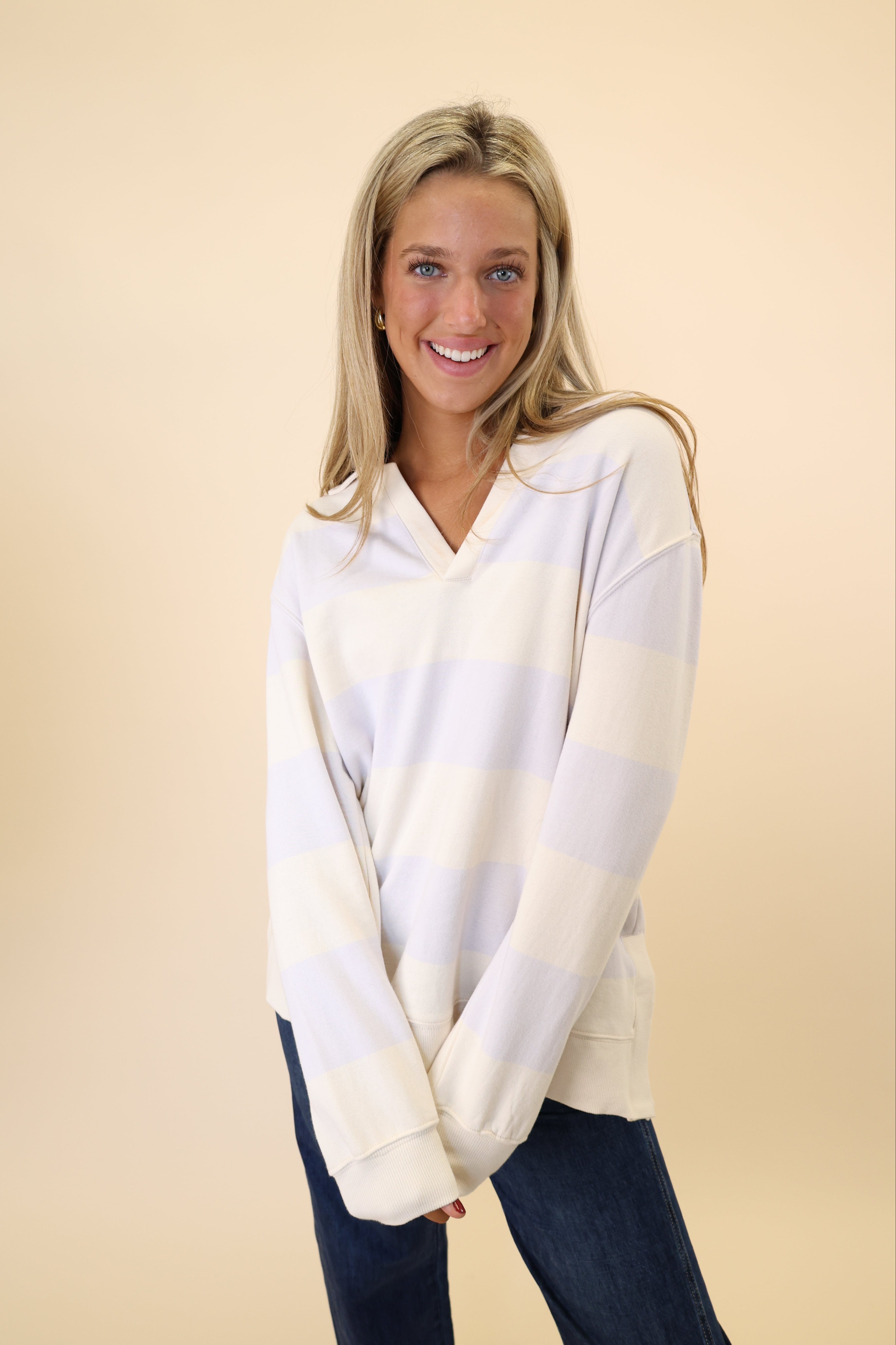 Beige Z Supply rugby Henley with oversized fit and comfortable, soft fabric.