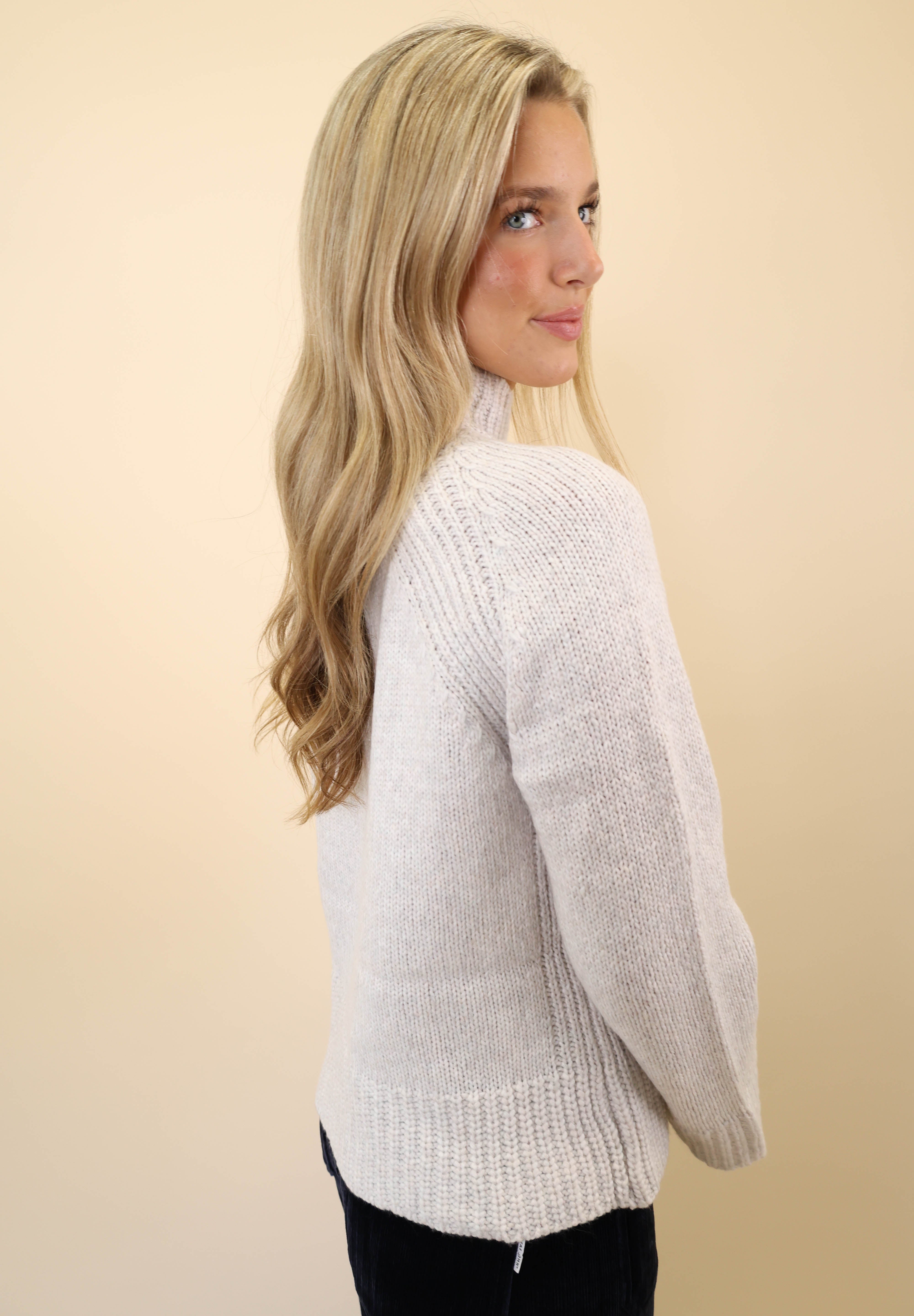 Z Supply Emerge white knit sweater featuring a soft funnel neckline and relaxed silhouette