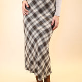 Model wearing the Z Supply Europa plaid midi skirt featuring a classic check pattern and mid-length silhouette.
