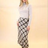 Z Supply Europa plaid midi skirt displayed on hanger, highlighting the timeless plaid pattern and midi length.