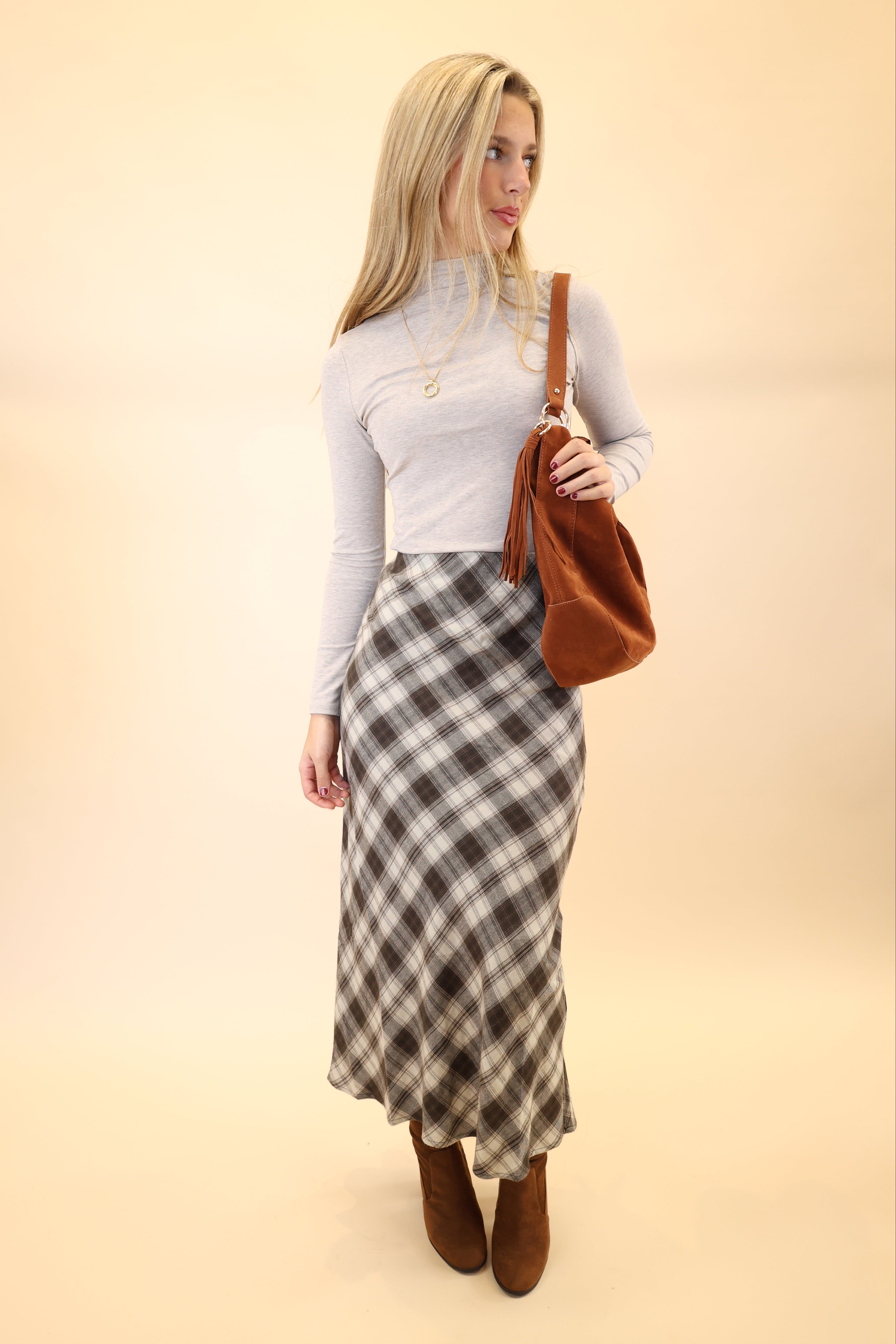 White Z Supply Lira top displayed on hanger, showing its clean lines and lightweight ribbed fabric.