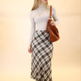 Woman styled in Z Supply Europa plaid midi skirt for a chic fall outfit.