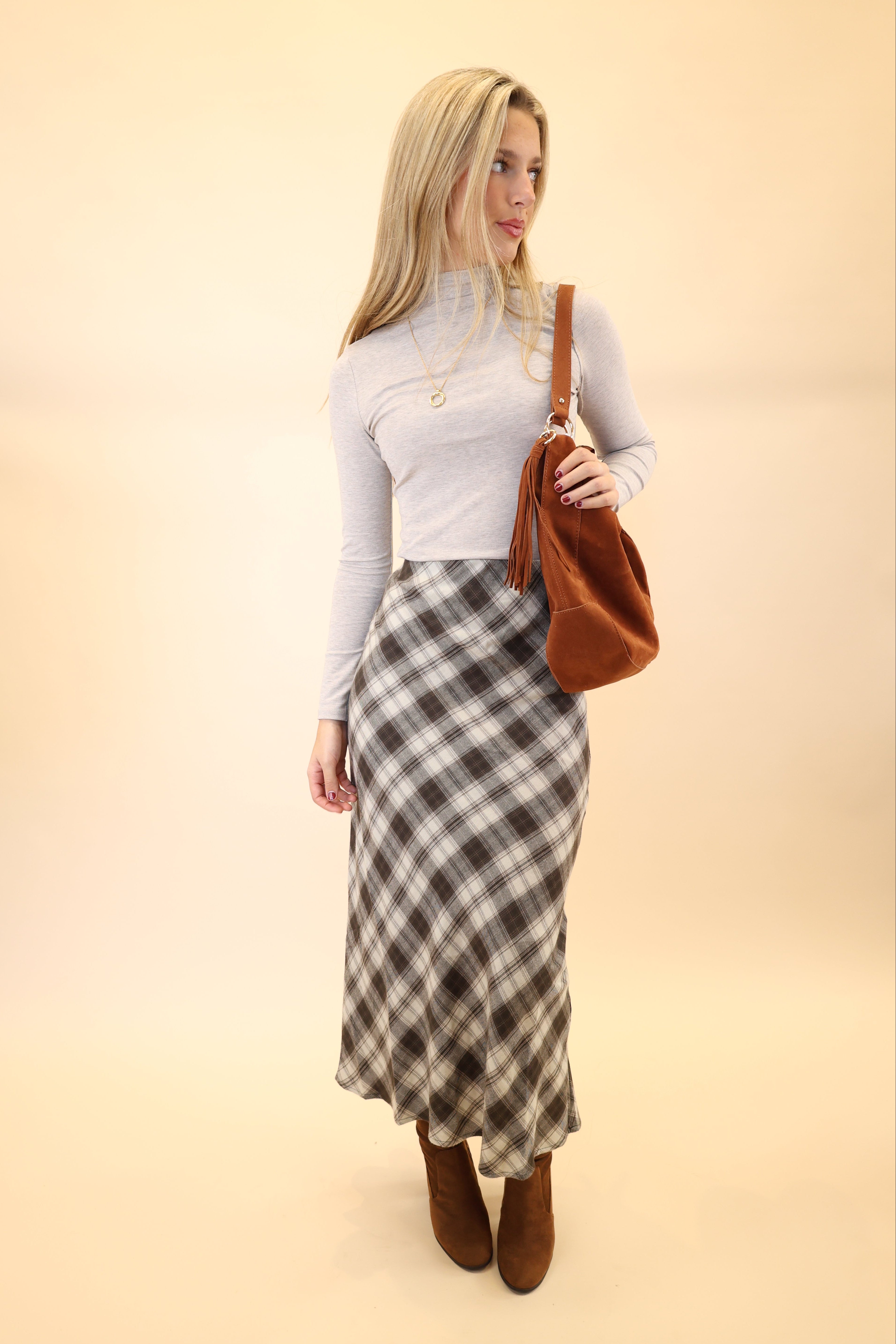 Woman styled in Z Supply Europa plaid midi skirt for a chic fall outfit.
