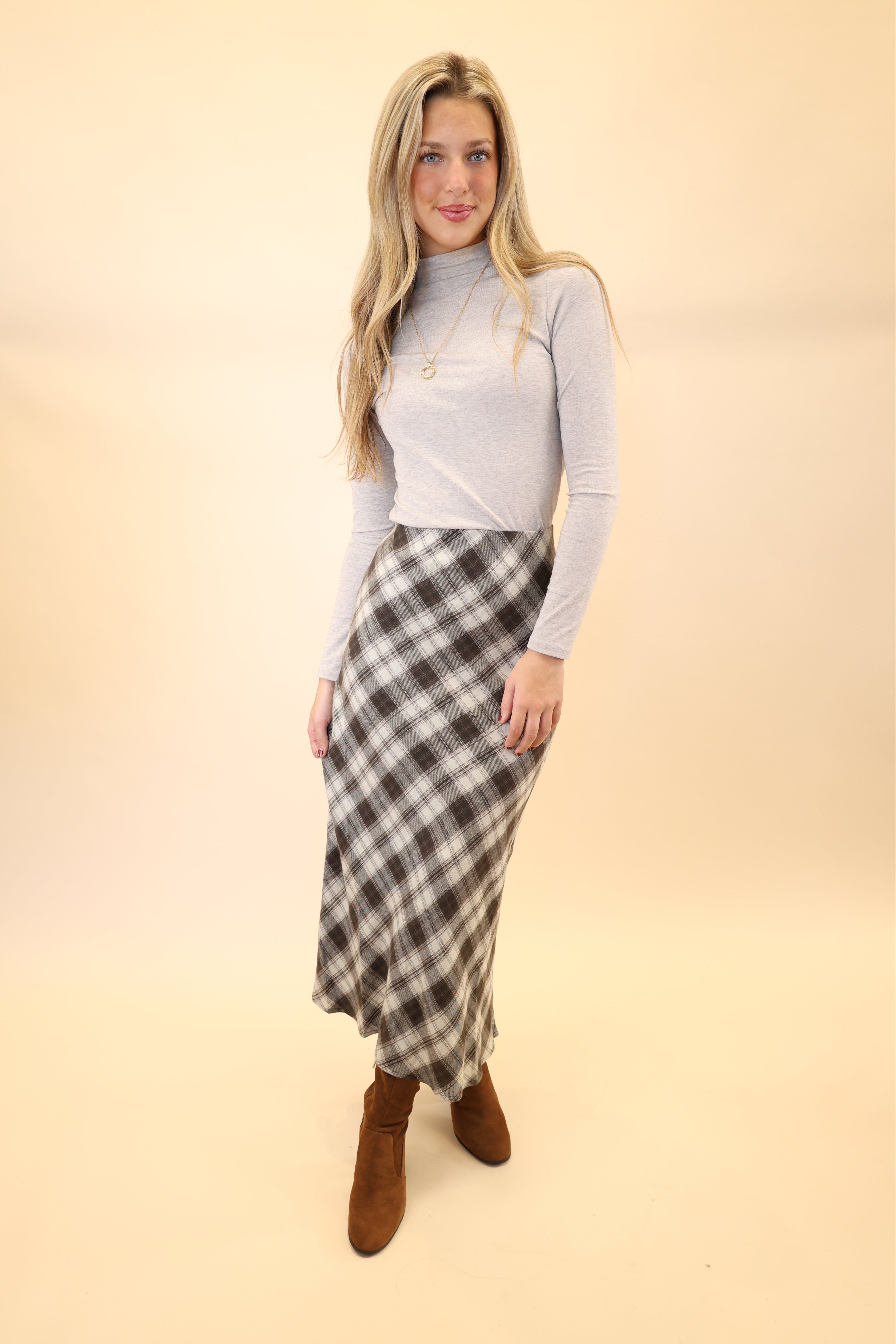 Z Supply Europa midi skirt in plaid, showing flowy movement and flattering ankle high cut. 