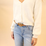 White fluffy Sadira cardigan by Z Supply, featuring a cozy V-neck and long sleeves.
