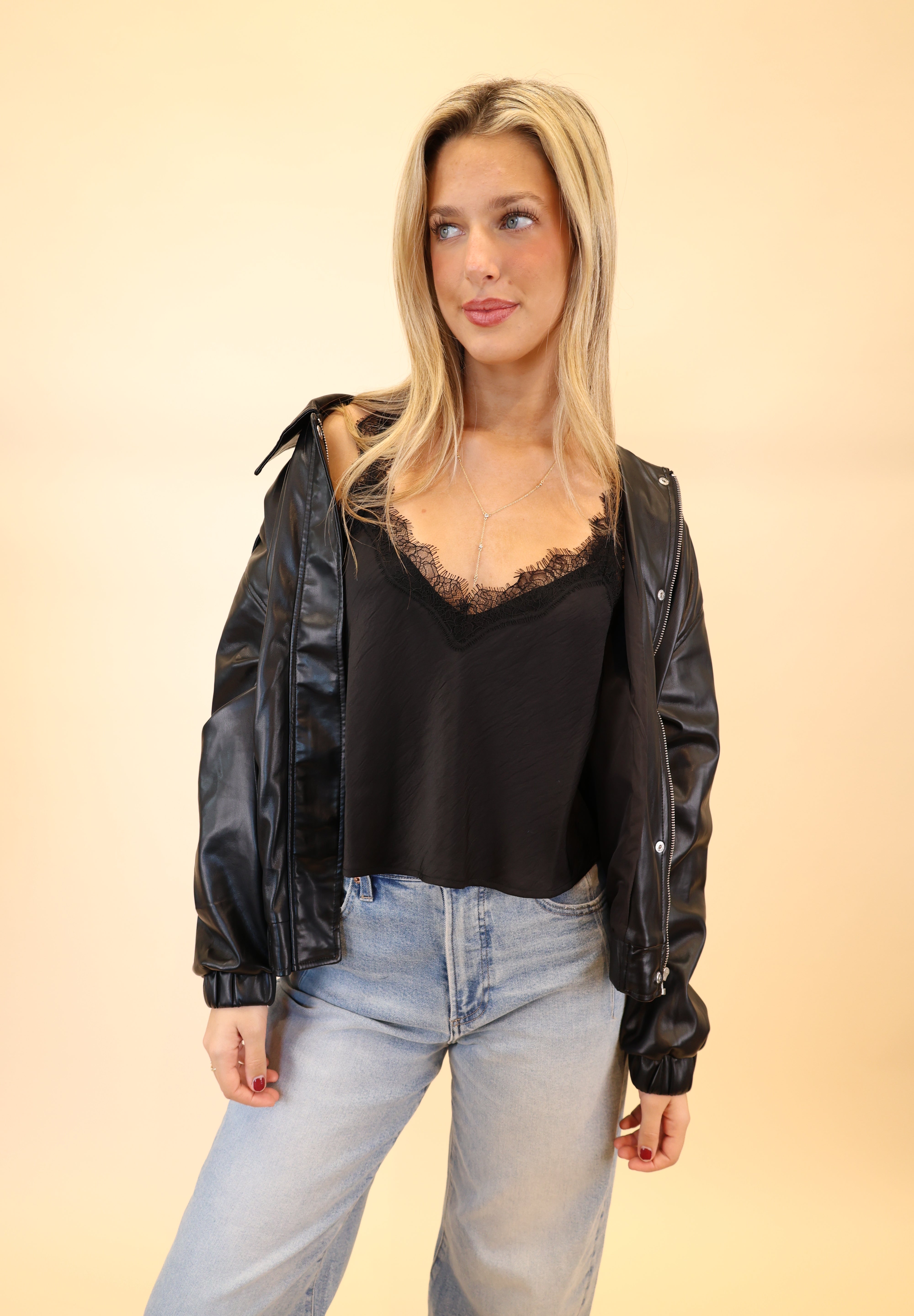 Front view of Z Supply Uma satin cami in black with lace V-neck, regular fit, and adjustable spaghetti straps.