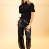 Black high-rise Z Supply Marli pants featuring soft faux leather and wide-leg silhouette.
