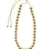 Gemelli Large Ball Necklace featuring polished gold ball beads with an adjustable drawstring closure.
