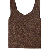 Gold Lurex V-neck seamless top styled under a jacket for an elevated evening look