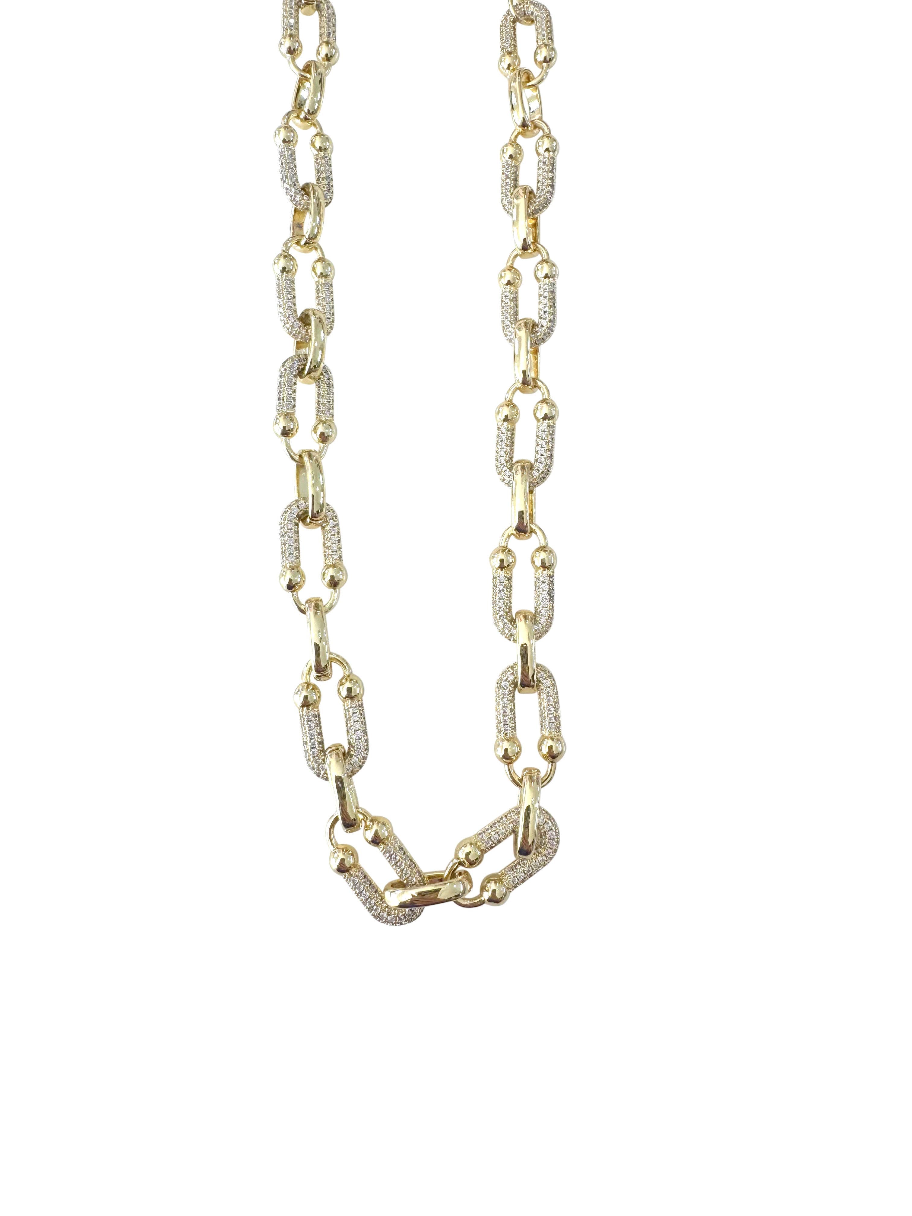 Gemelli Goldie Chain Link CZ Necklace featuring bold gold chain links accented with sparkling cubic zirconia details.
