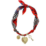 Gemelli Chan Multi Charm Scarf Necklace in soft gray and white hues, featuring a lightweight fabric design with interchangeable charms. 