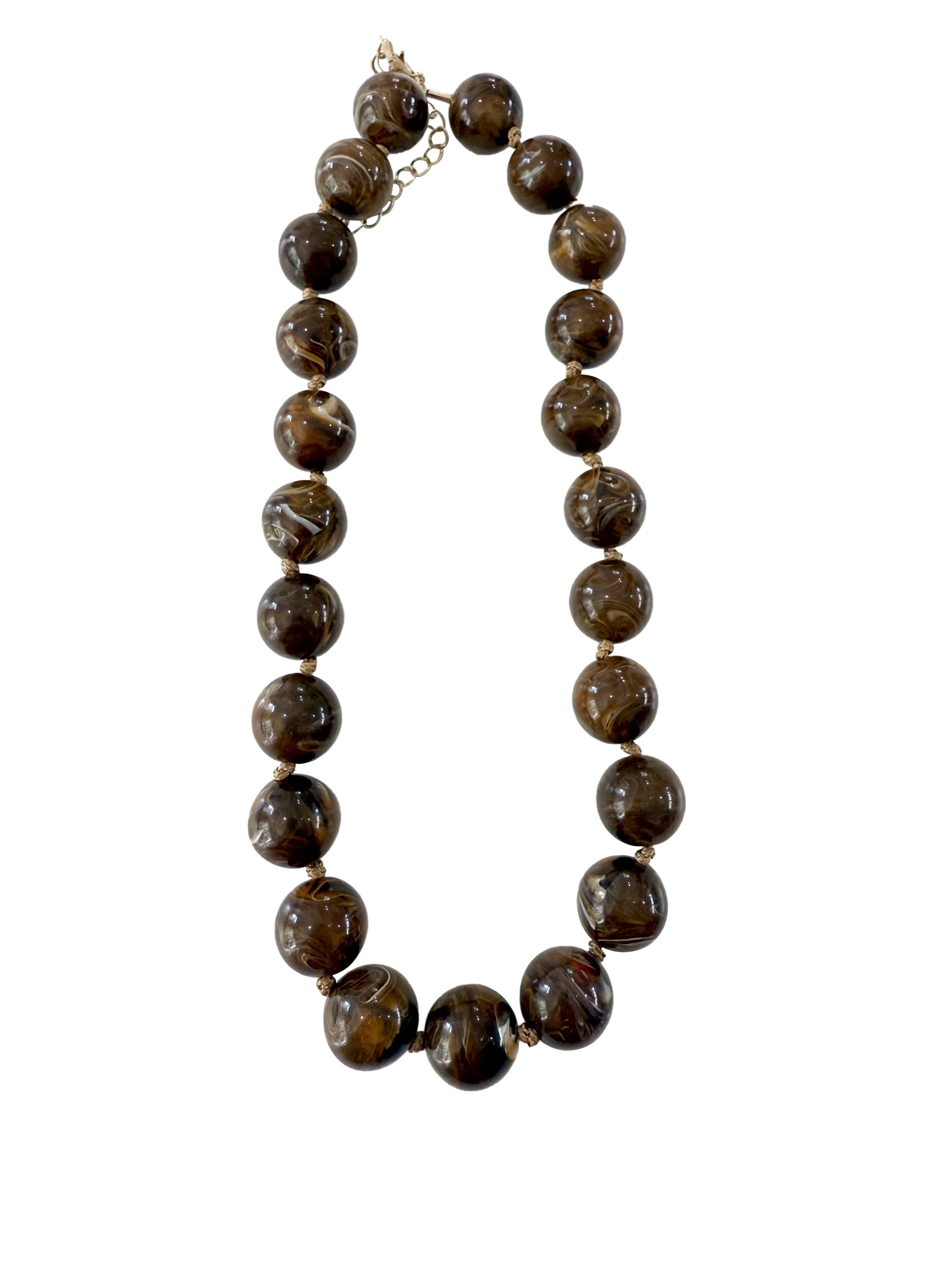 Gemelli Marby Chunky Beaded Necklace featuring large glossy marbled Brown beads, natural swirl variations, and an adjustable clasp. 