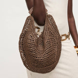 Crochet-woven summer hobo bag in rich chocolate brown designed for everyday wear and vacation styling