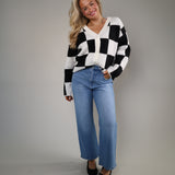 Women’s checkered cardigan with V-neckline and button-front closure
