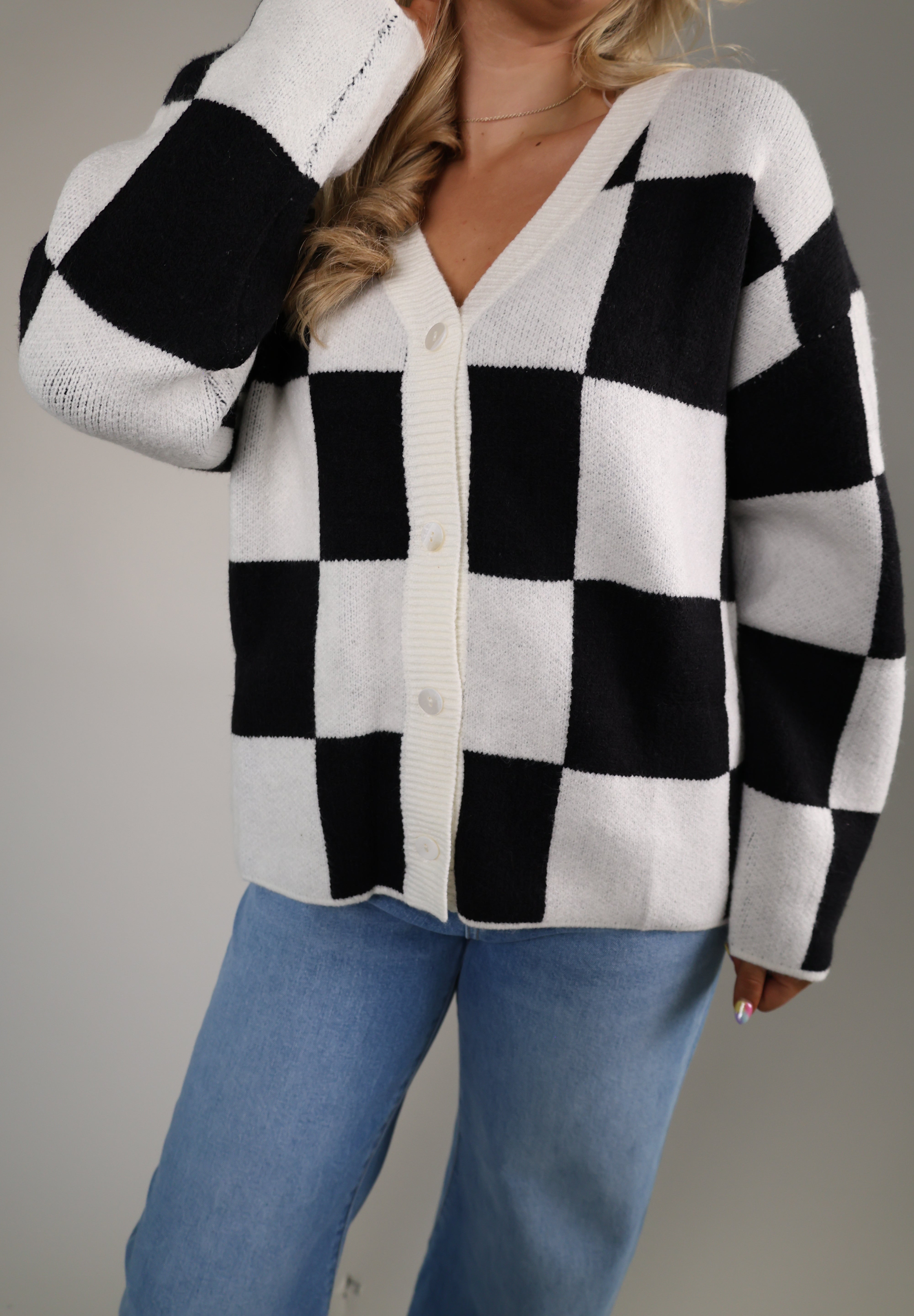 Preppy women’s knit cardigan styled with denim for an everyday fall outfit