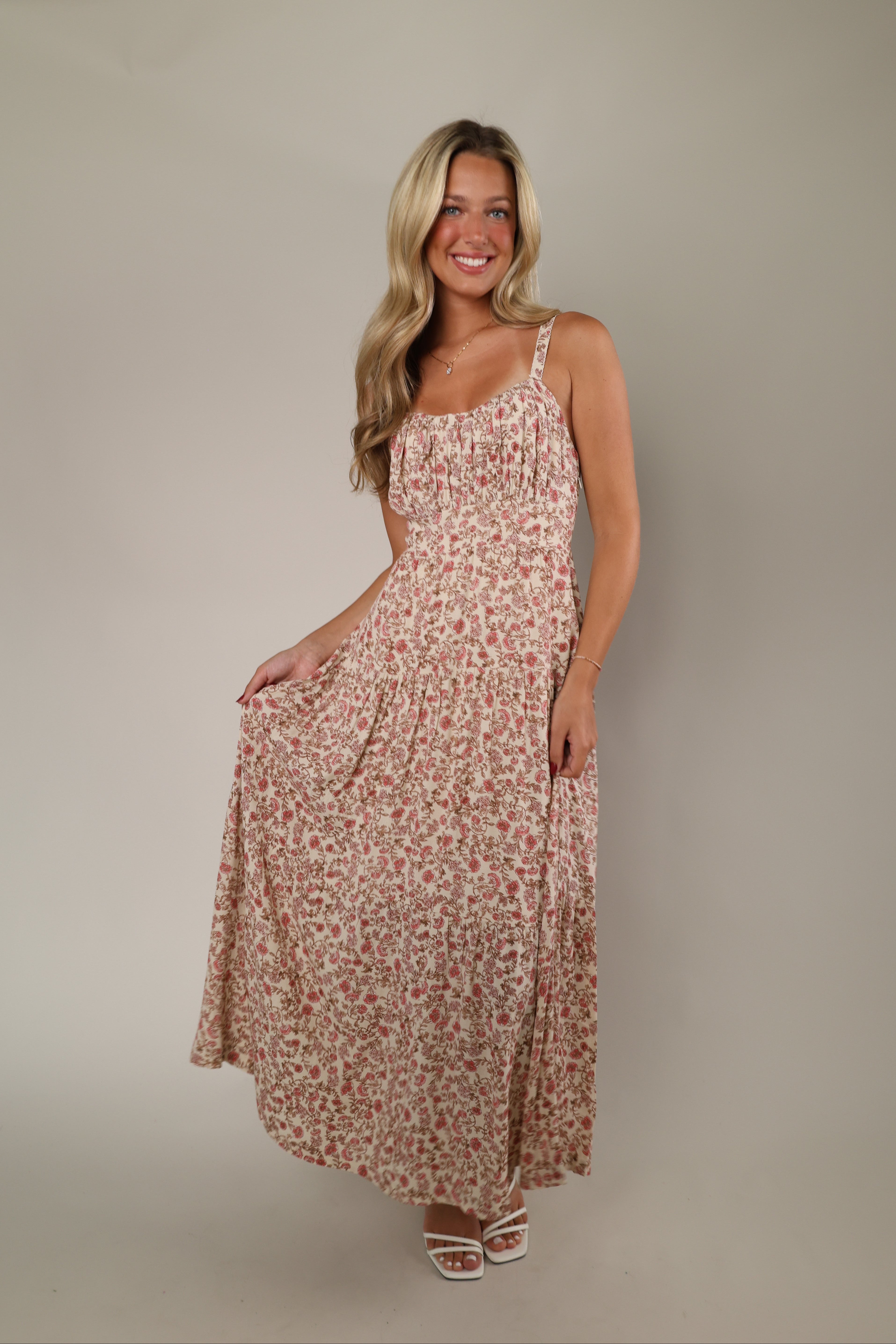 Women's floral dress featuring allover floral print, lightweight fabric, flattering silhouette, casual summer dress for vacations, brunch, and special occasions