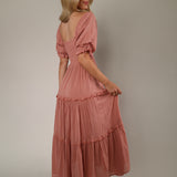 Woman wearing Eliora Maxi Dress featuring flowing maxi-length silhouette, lightweight fabric, feminine fit, wedding guest dress, bridal shower outfit, vacation dress, and summer occasion wear