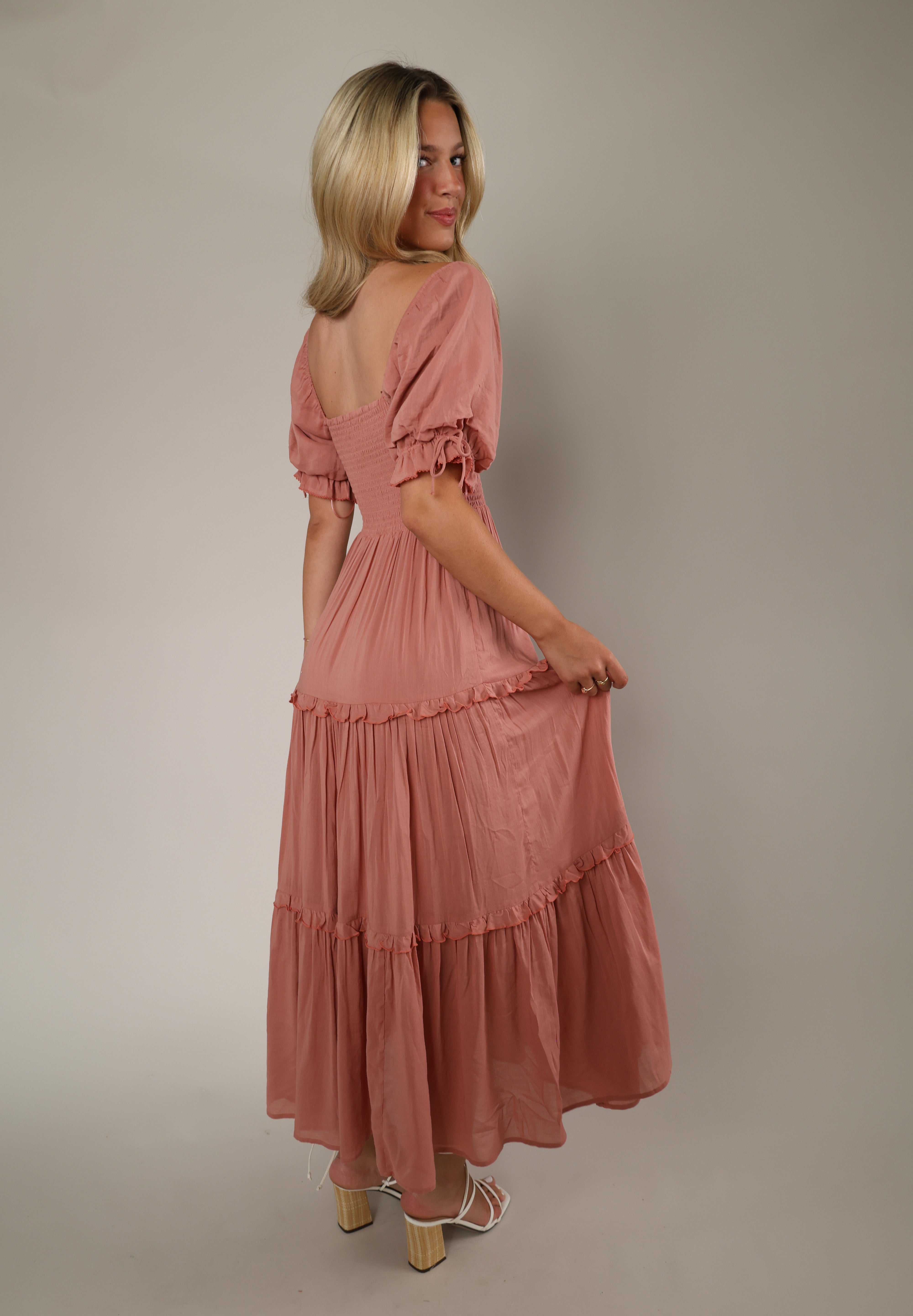 Woman wearing Eliora Maxi Dress featuring flowing maxi-length silhouette, lightweight fabric, feminine fit, wedding guest dress, bridal shower outfit, vacation dress, and summer occasion wear