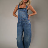 Light wash denim overalls with a relaxed wide-leg silhouette, oversized fit, and lived-in feel for easy everyday styling.