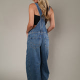 Free People Good Luck Overall in Ultra Light Beam styled for a laid-back look with a wide-leg fit, utility details, and relaxed silhouette perfect for layering. 
