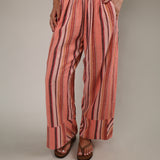 Free People Days End Linen Stripe Pant in Soft Coral Combo featuring relaxed wide-leg silhouette, lightweight linen blend fabric, stripe pattern, and elastic waistband