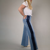 Light wash Dear John wide-leg jeans with contrast side accents and a flowy full-length silhouette for a trendy elevated denim style.