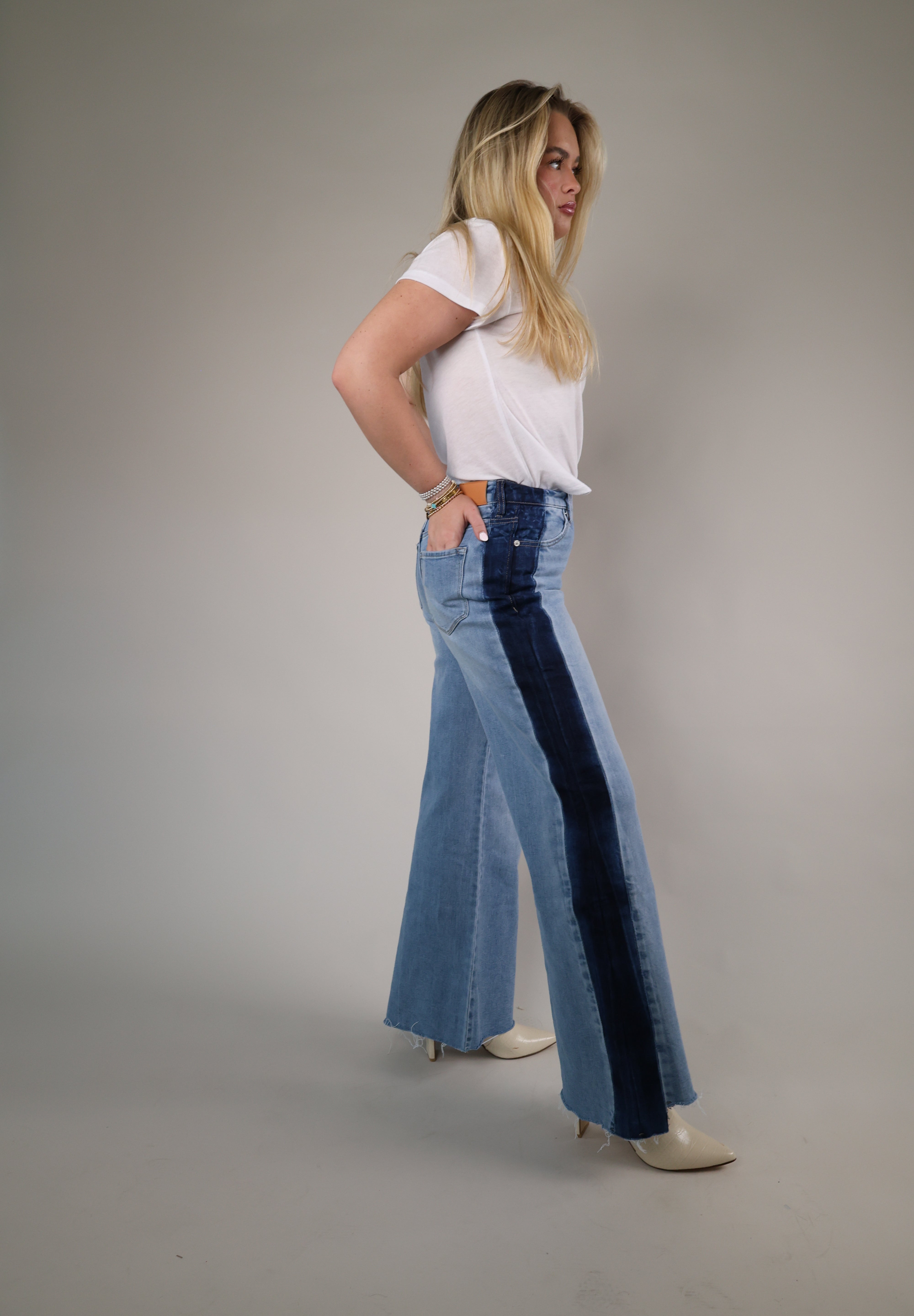 Light wash Dear John wide-leg jeans with contrast side accents and a flowy full-length silhouette for a trendy elevated denim style.