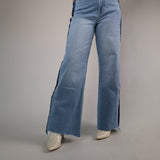 High-waisted wide-leg denim featuring mixed wash paneling, soft structured fabric, and an effortlessly cool statement look.
