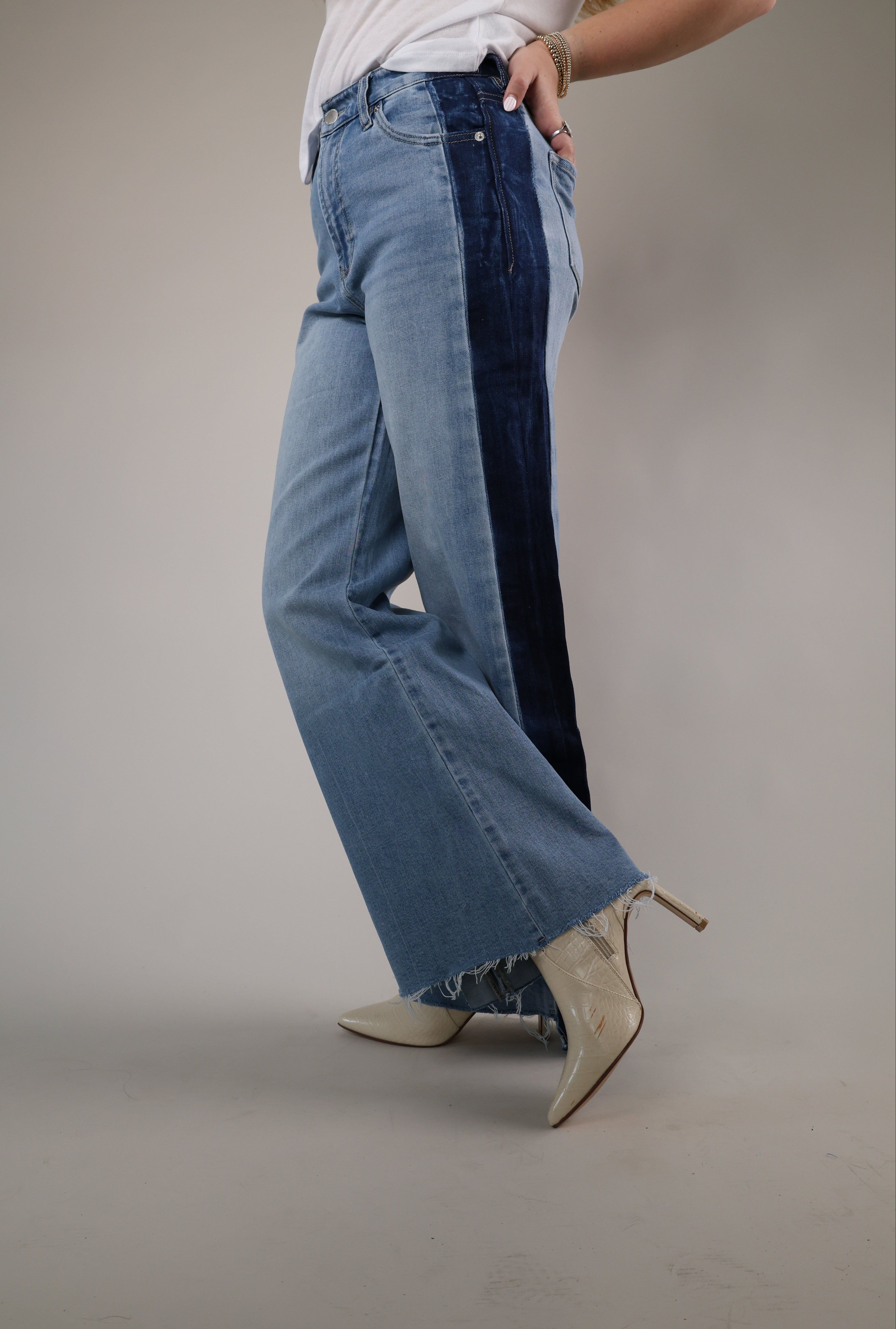 Woman wearing Dear John Fiona Wide Leg Jeans in Tana featuring a high-rise fit, wide-leg silhouette, and contrast dark denim side panels.