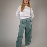 Cozy white knit sweater by Z Supply featuring a breathable crochet-style texture and ribbed waistband for an effortless look.