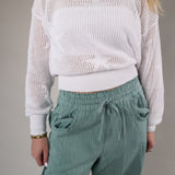 Woman wearing the Z Supply Star of the Show Sweater in a lightweight white open-knit design with long sleeves and a relaxed fit.