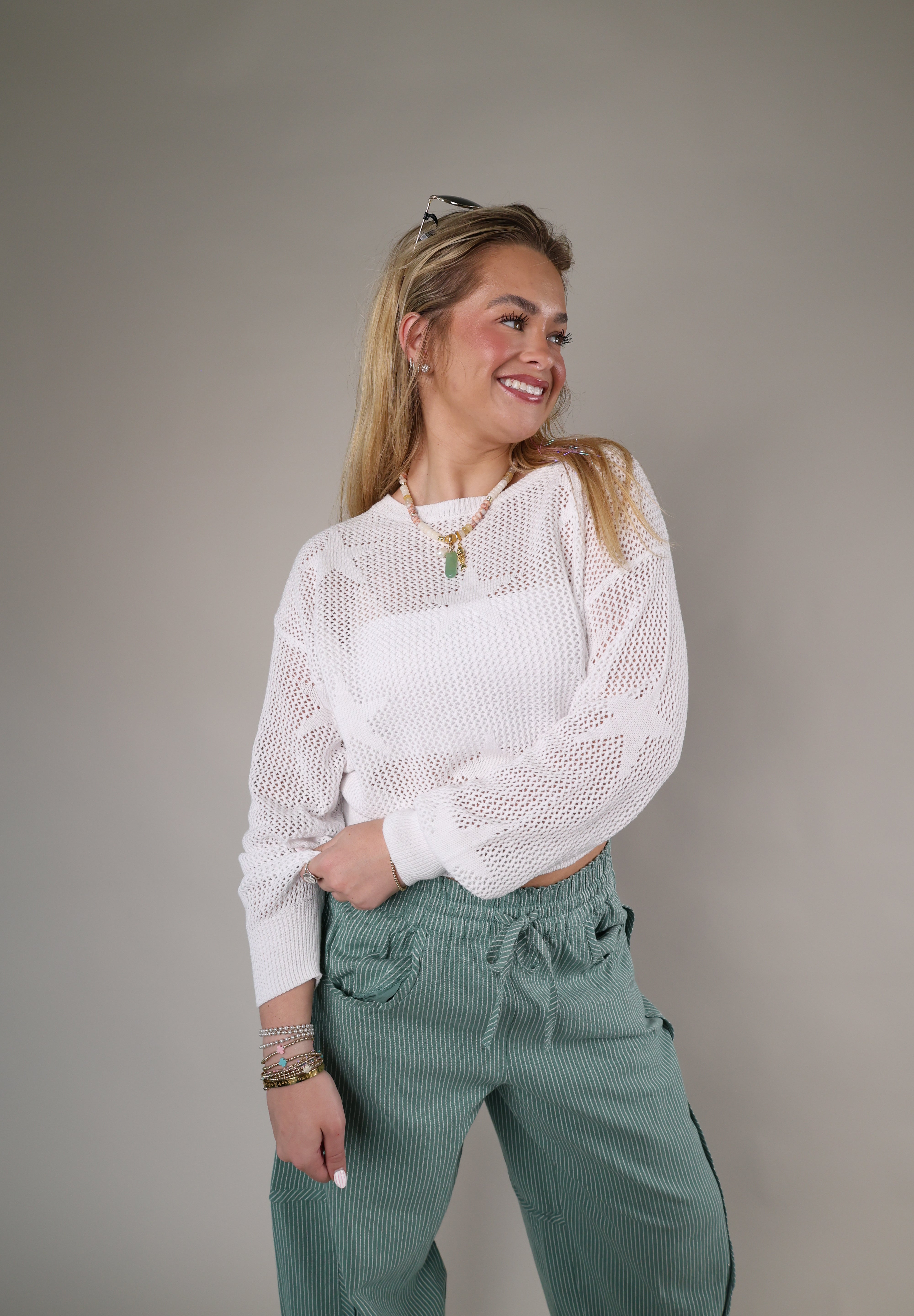 Z Supply Star of the Show Sweater styled with green patterned pants, showcasing a soft airy knit and casual silhouette.