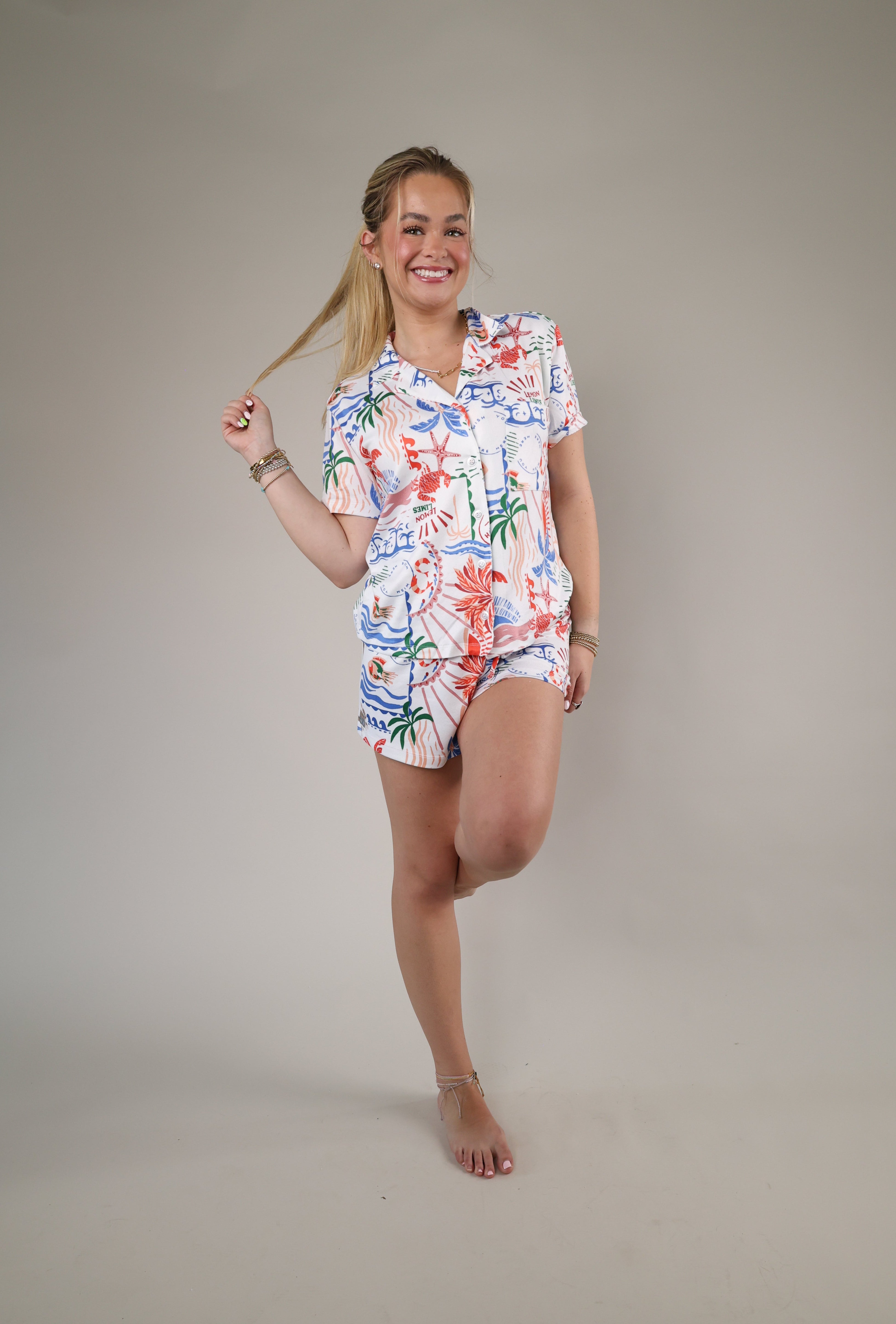 Woman wearing the Z Supply Classic Soley Getaway Shorts featuring a colorful tropical floral print and relaxed lightweight fit.