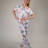 Z Supply So Sweet Getaway Pants styled with a matching pajama top, showcasing vibrant coastal graphics and an easy vacation-ready look.