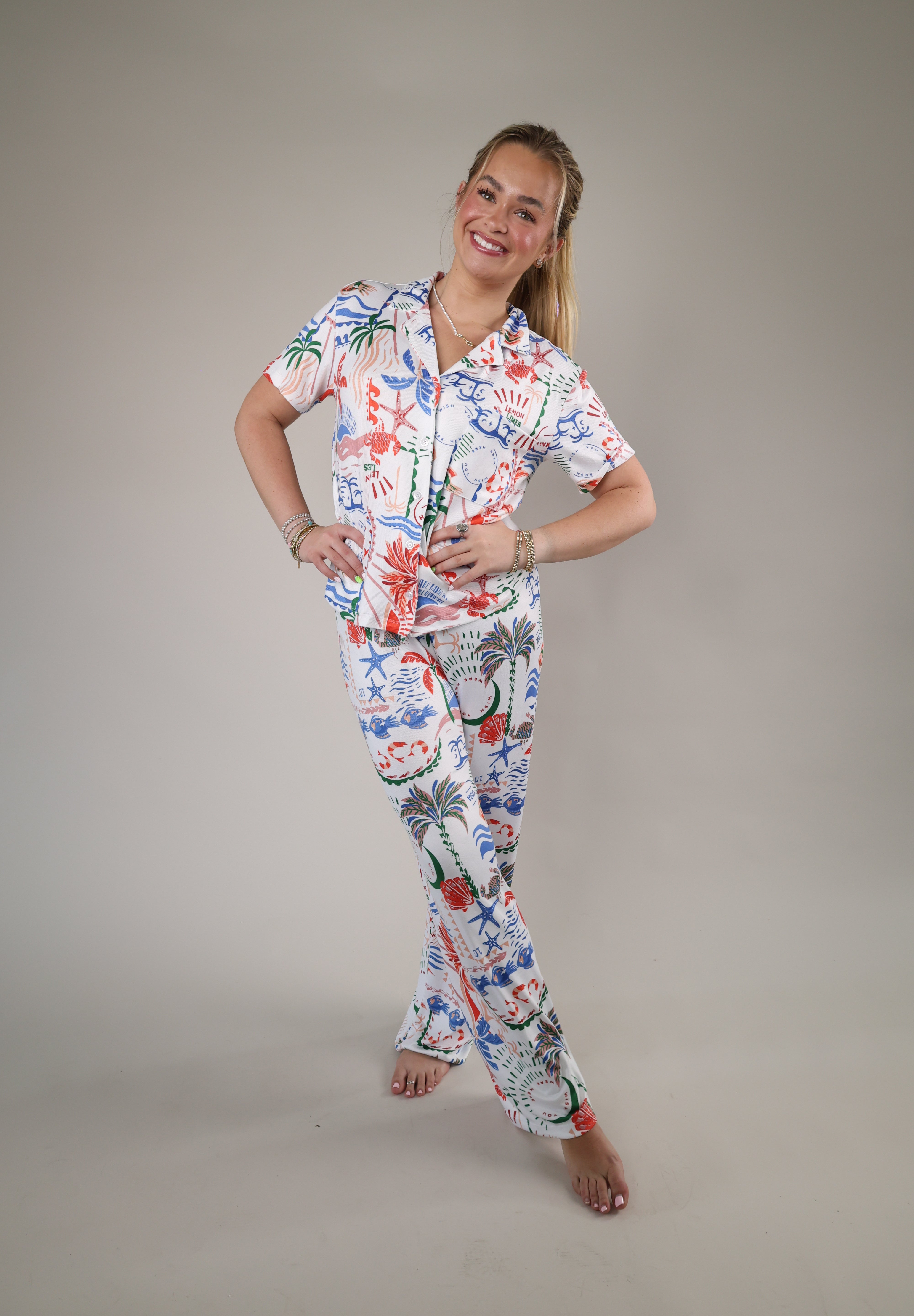 Z Supply So Sweet Getaway Pants styled with a matching pajama top, showcasing vibrant coastal graphics and an easy vacation-ready look.