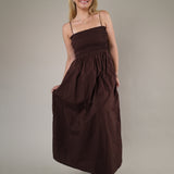 Z Supply Cornelia Poplin Maxi Dress in Chocolate Cherry styled with sandals, showcasing a relaxed fit and elegant full-length design.