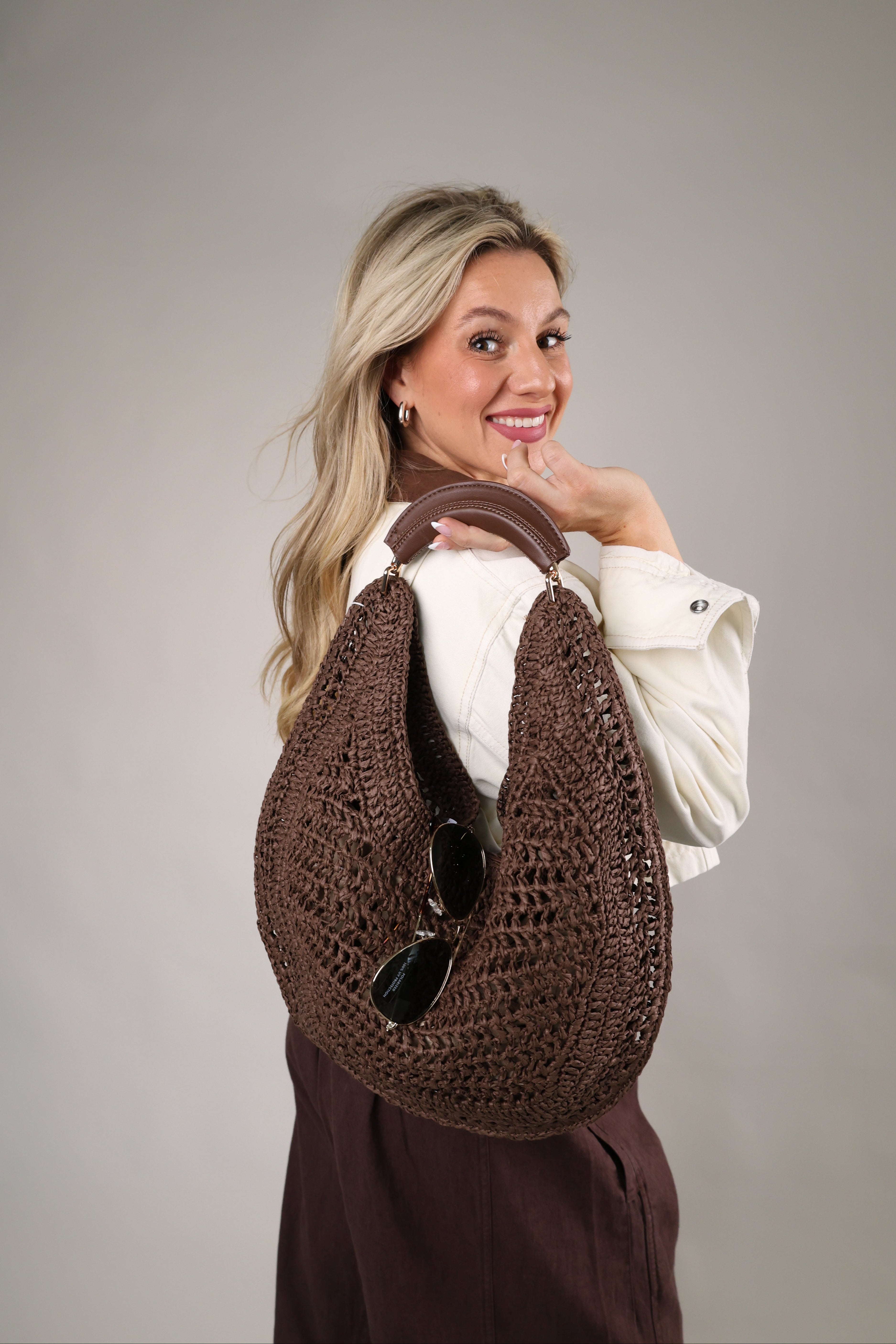 Chocolate Camden Hobo bag featuring a slouchy crochet-woven silhouette and padded top handle for summer styling