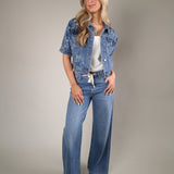Modern short sleeve denim jacket from Shear Boutique with chest flap pockets and a chic elevated casual fit