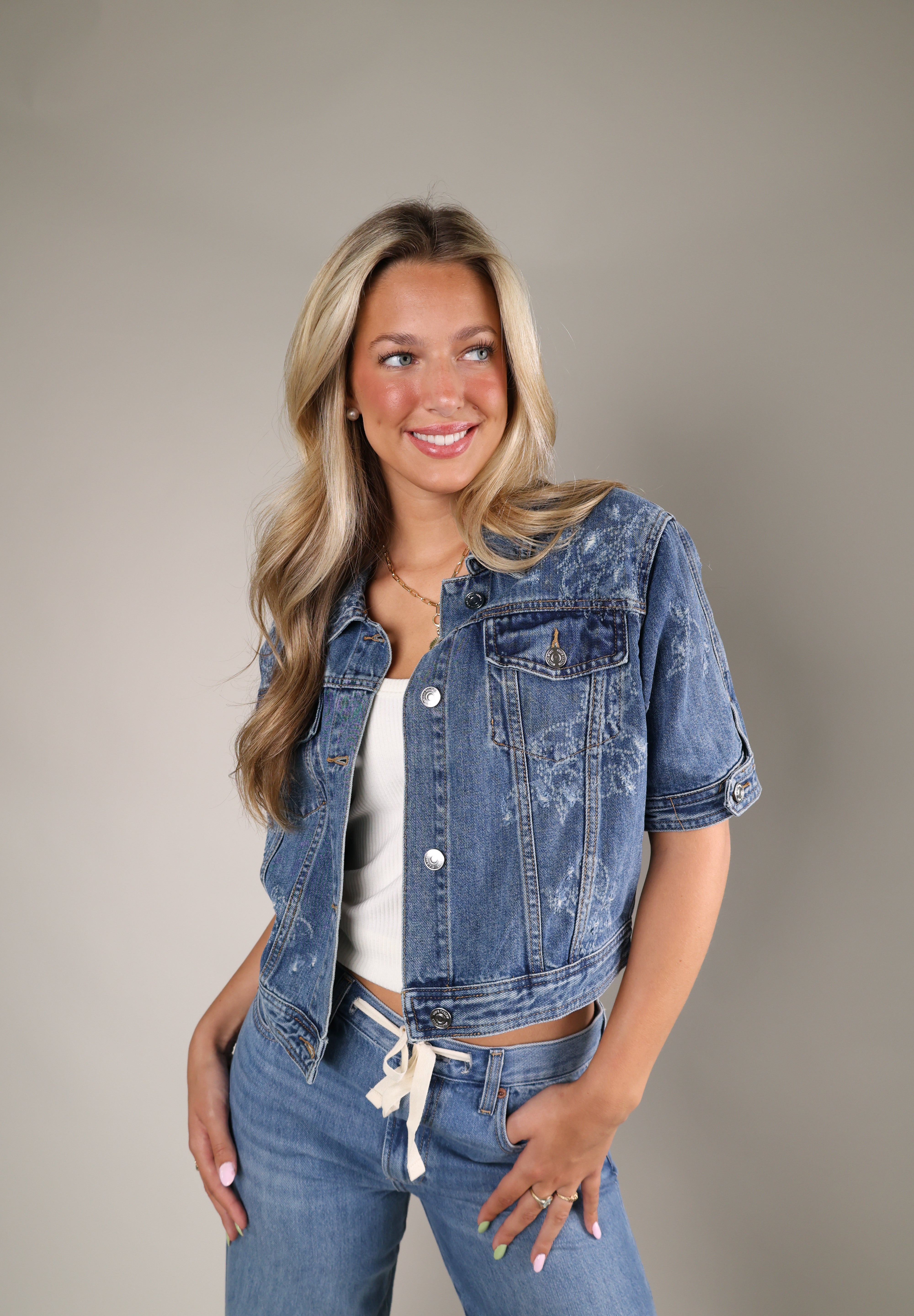 Shear Boutique Blu Denim Jacket featuring a modern trucker silhouette and extended short sleeves for effortless summer layering