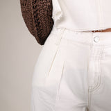 Elevated off white pleated pants from Shear Boutique designed with lightweight woven fabric and an effortlessly polished fit