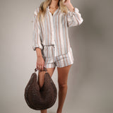 The Perfect Striped Button Up, a versatile women’s summer layering shirt with relaxed boutique style perfect for travel and beach days