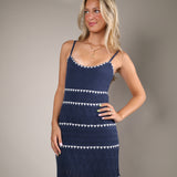 Relaxed twilight blue striped summer dress styled with sandals and a woven tote for an easy vacation ready look