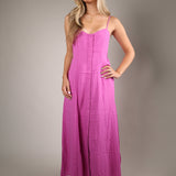 Chic blush pink midi dress with a soft romantic shape perfect for weddings vacations and elevated summer occasions